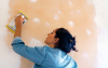 hispanic woman remodeling her home in the berkshires with a greylock home equity loan